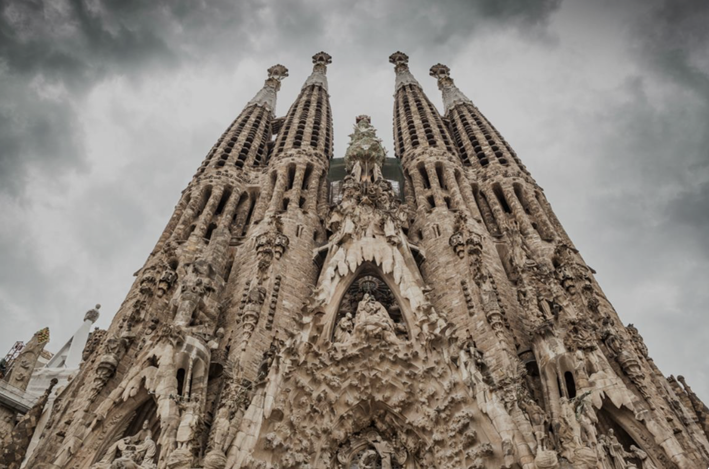 Towering spires of Sagrada Família reaching toward the sky with ornate Gothic details