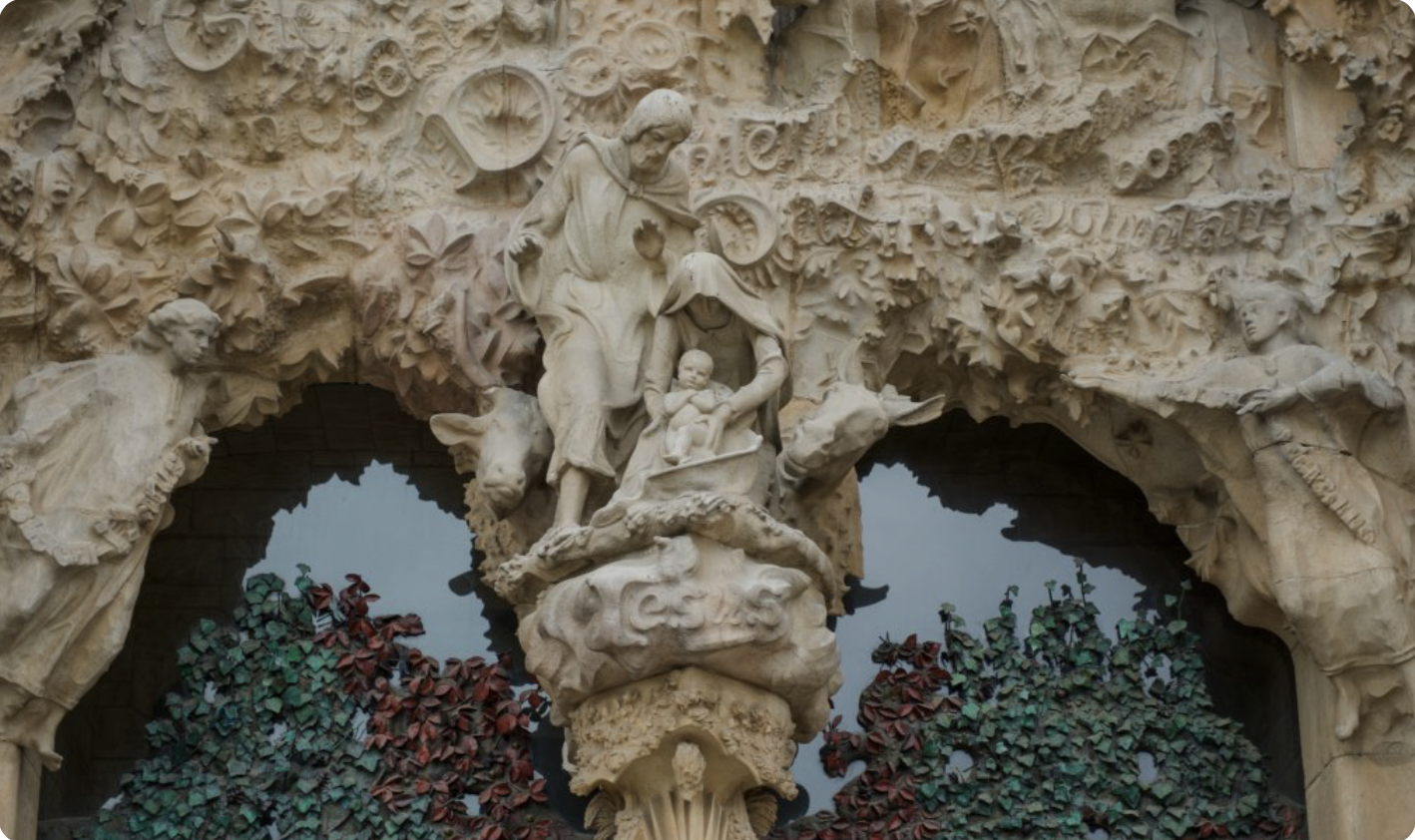 The Nativity Façade of Sagrada Família showing intricate stone carvings depicting Christ's birth